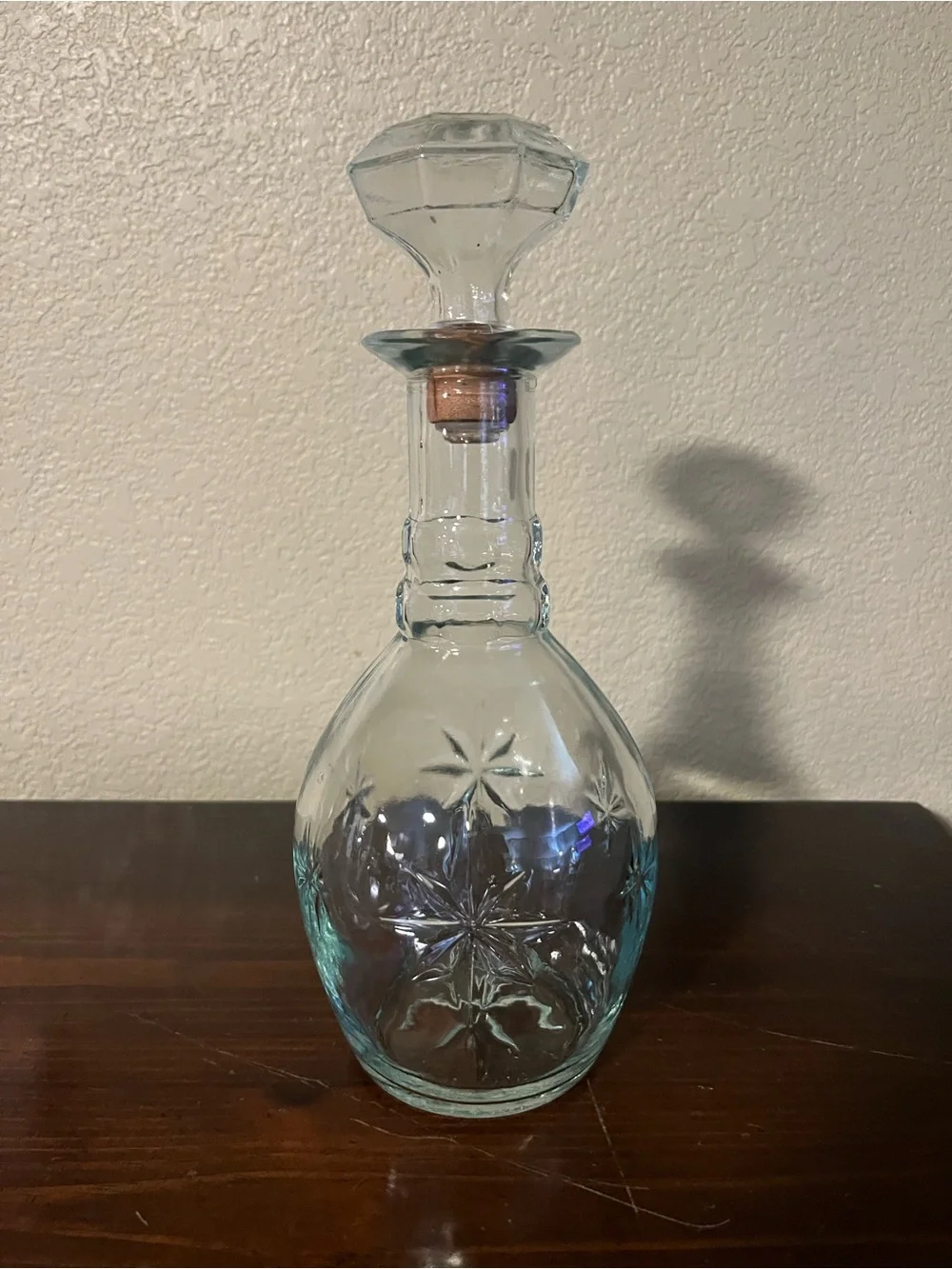 Vintage Clear Glass Decanter with a distinct starburst pattern and matching top